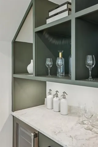 a spacious bedroom with a bed a window and potted plant