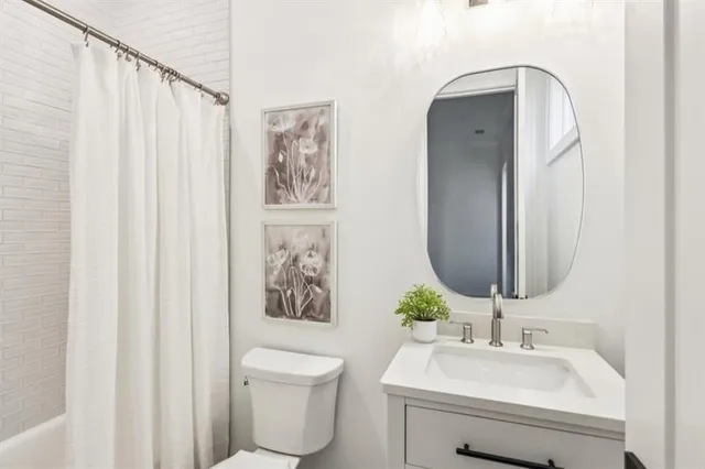 a living room with furniture flowerpot and window