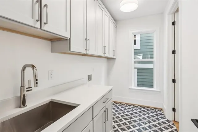 a view of a house with sitting area and garden