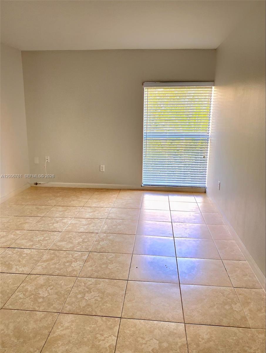 2160 Southwest 16th Avenue, Unit 417 Miami, FL 33145 - Photo 13 of 24 a view of an empty room with a window