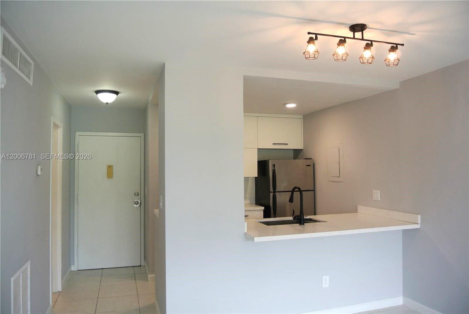 2160 Southwest 16th Avenue, Unit 417 Miami, FL 33145 - Photo 4 of 24 a view of a kitchen with a sink