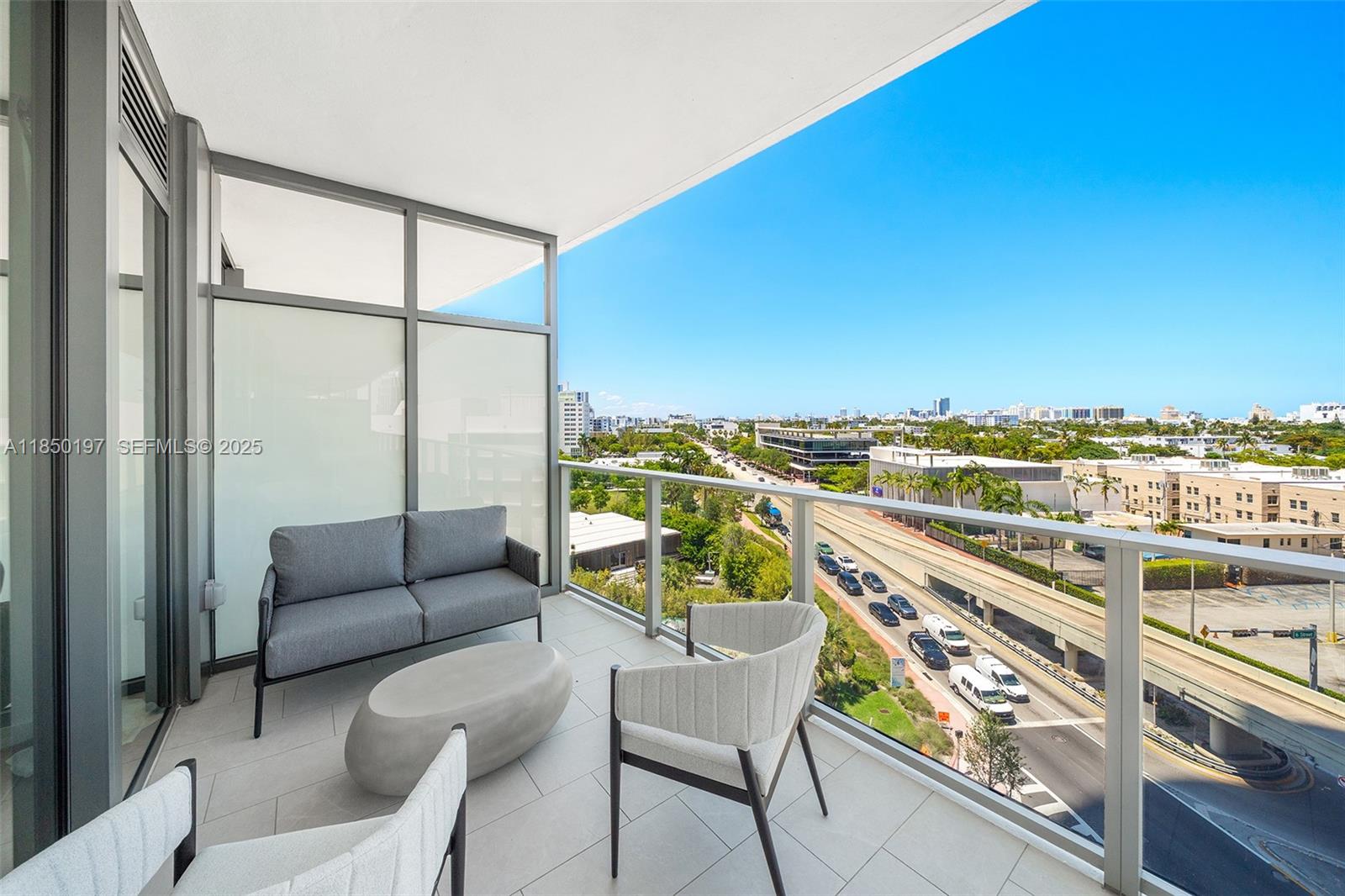 500 Alton Road, Unit 807 Miami Beach, FL 33139 - Photo 11 of 20 a balcony with furniture and city view