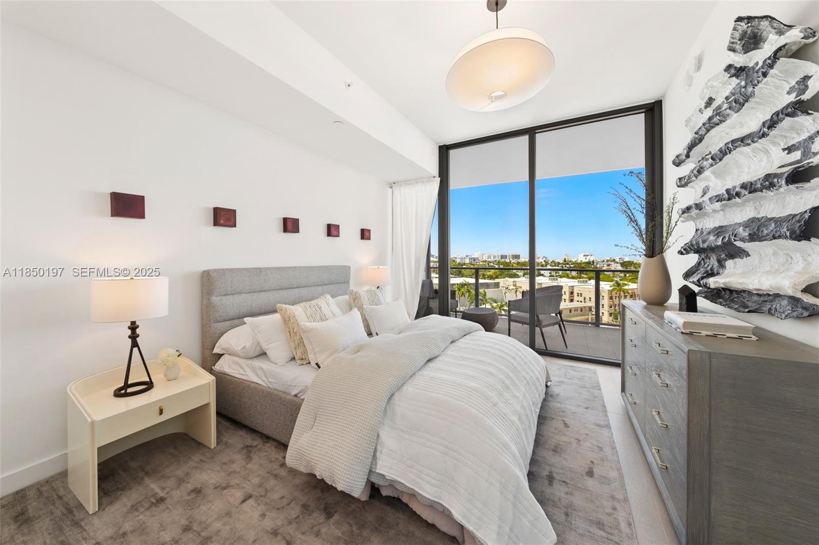 500 Alton Road, Unit 807 Miami Beach, FL 33139 - Photo 18 of 20 a living room with furniture and a floor to ceiling window