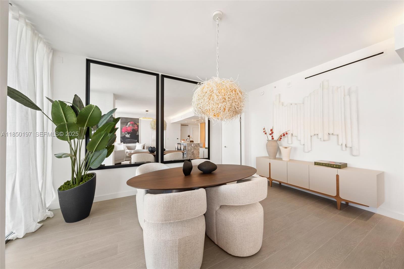 500 Alton Road, Unit 807 Miami Beach, FL 33139 - Photo 4 of 20 a living room with furniture and a large window