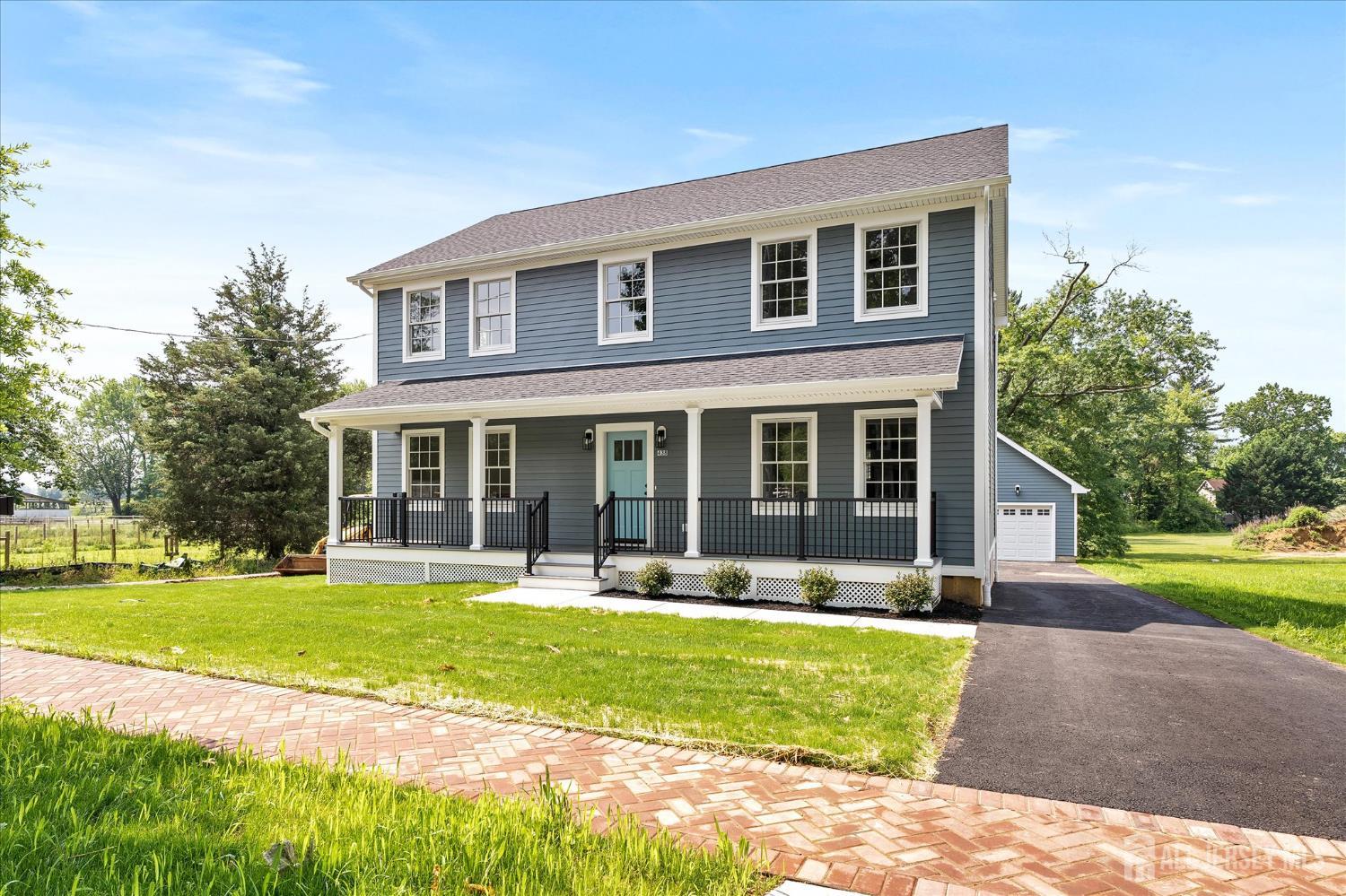 438 Ellisdale Road Chesterfield, NJ 08515 - Photo 1 of 28 a front view of a house with a yard and patio