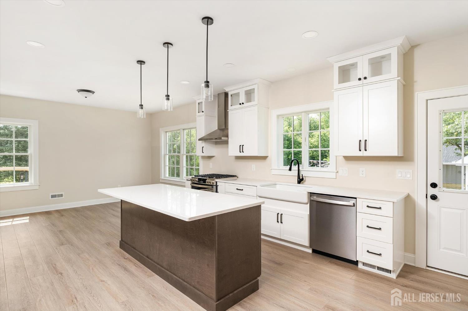 438 Ellisdale Road Chesterfield, NJ 08515 - Photo 12 of 28 a kitchen with a sink stove and cabinets