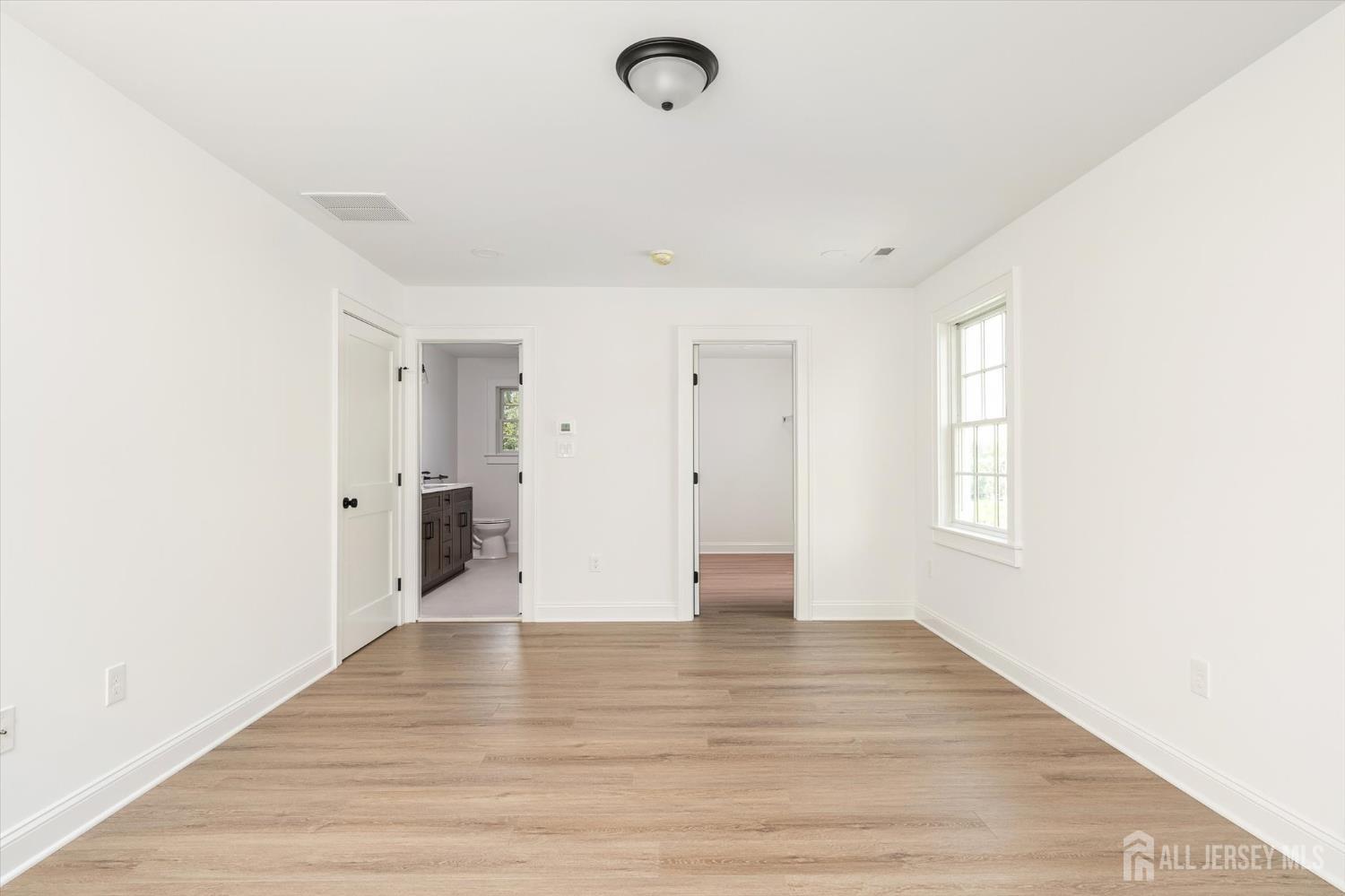 438 Ellisdale Road Chesterfield, NJ 08515 - Photo 22 of 28 a view of an empty room with wooden floor and a window