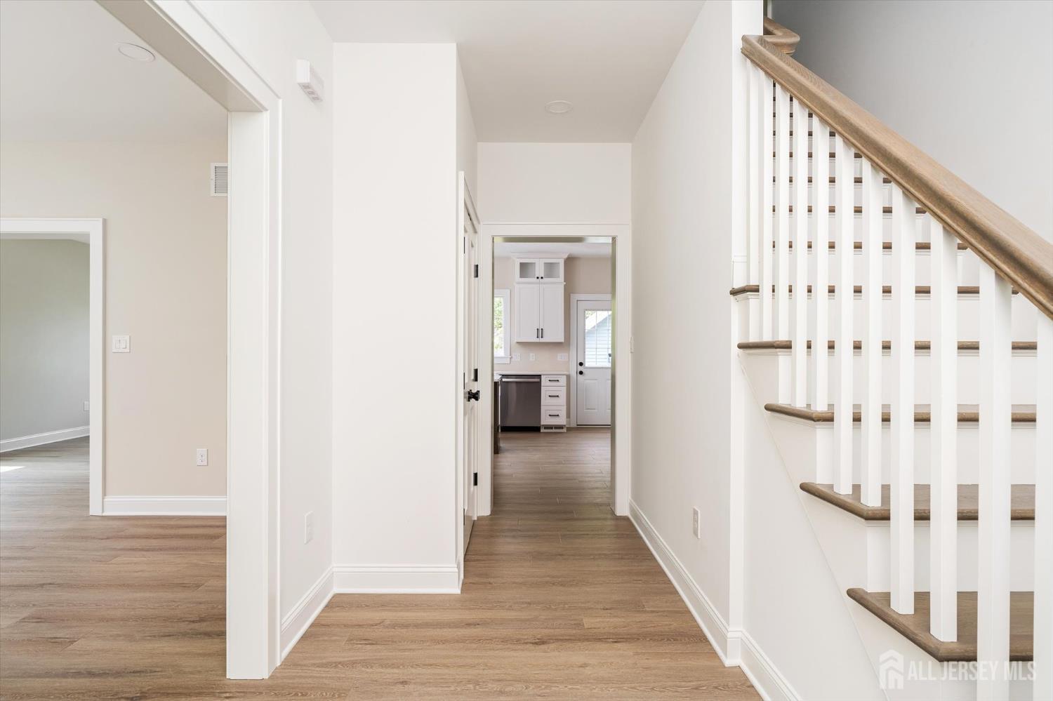 438 Ellisdale Road Chesterfield, NJ 08515 - Photo 3 of 28 a view of a hallway with wooden floor and staircase