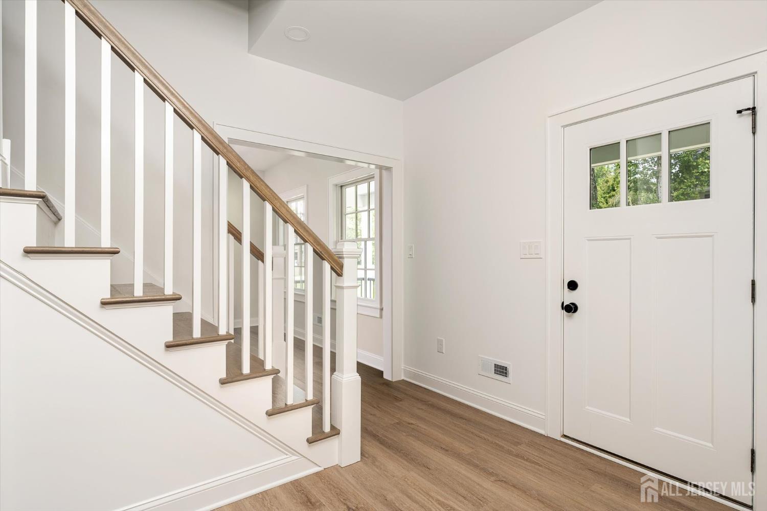 438 Ellisdale Road Chesterfield, NJ 08515 - Photo 4 of 28 a view of an entryway with wooden floor and door