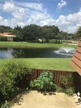 a view of a lake with a yard