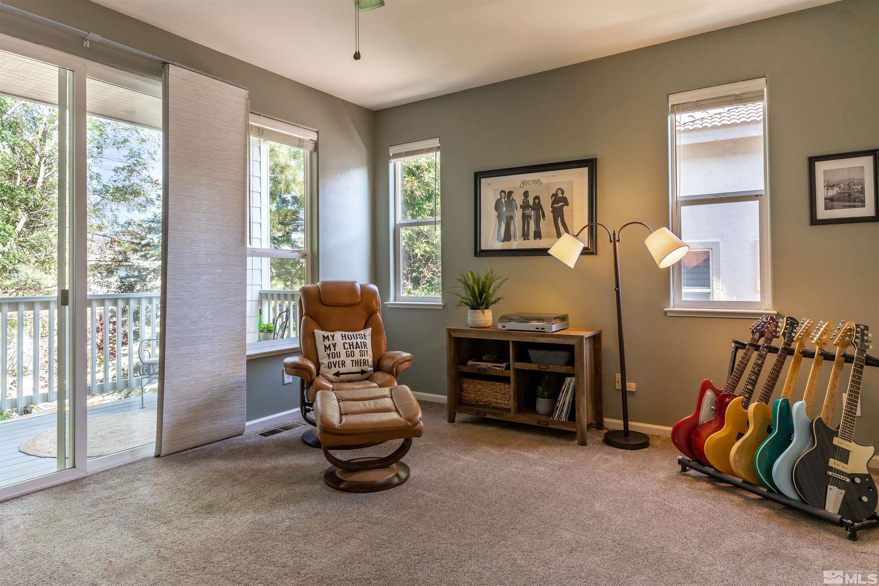 4829 Ramcreek Trail Reno, NV 89519 - Photo 21 of 40 a living room with furniture and a floor to ceiling window