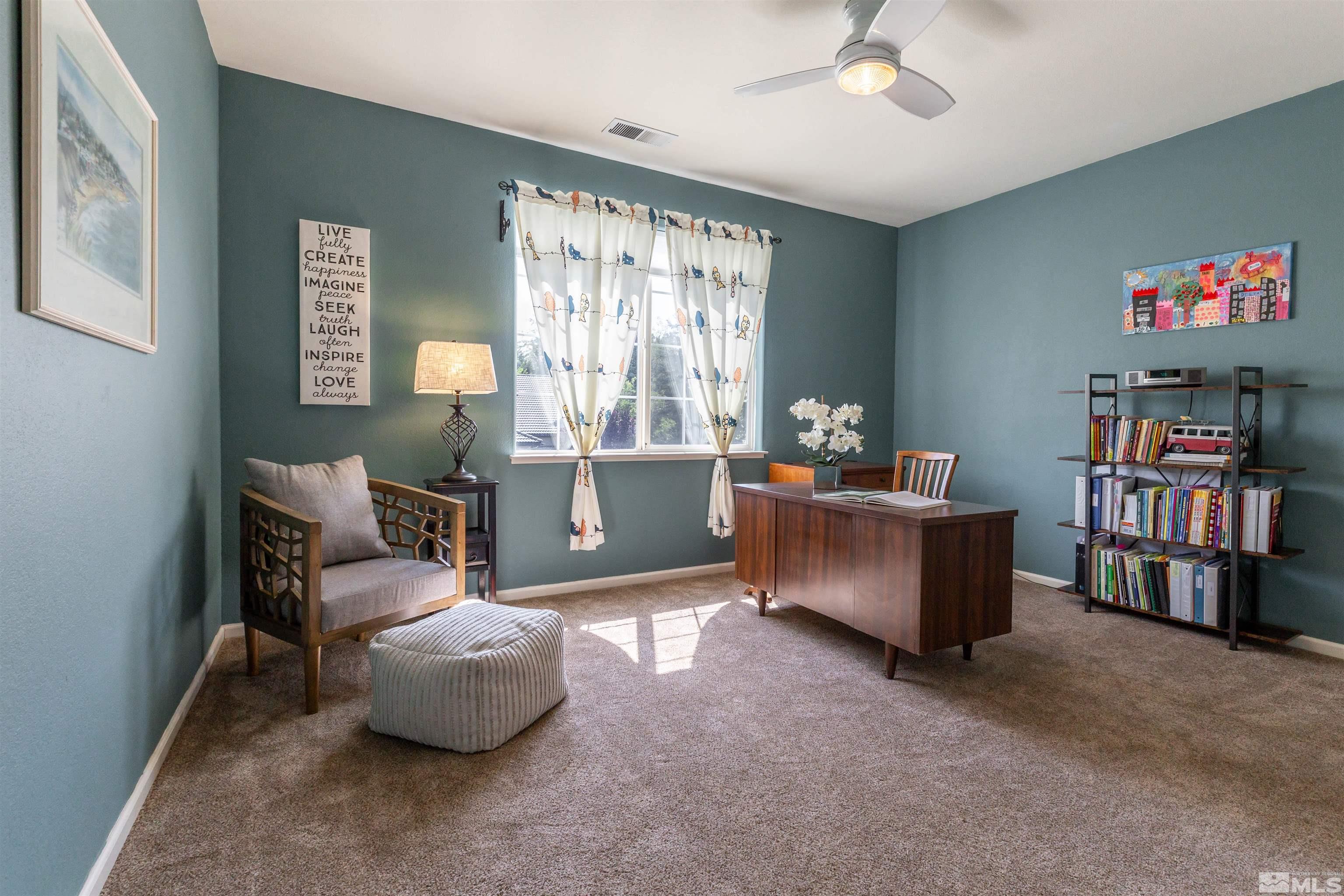 4829 Ramcreek Trail Reno, NV 89519 - Photo 25 of 40 a living room with furniture and a bookshelf