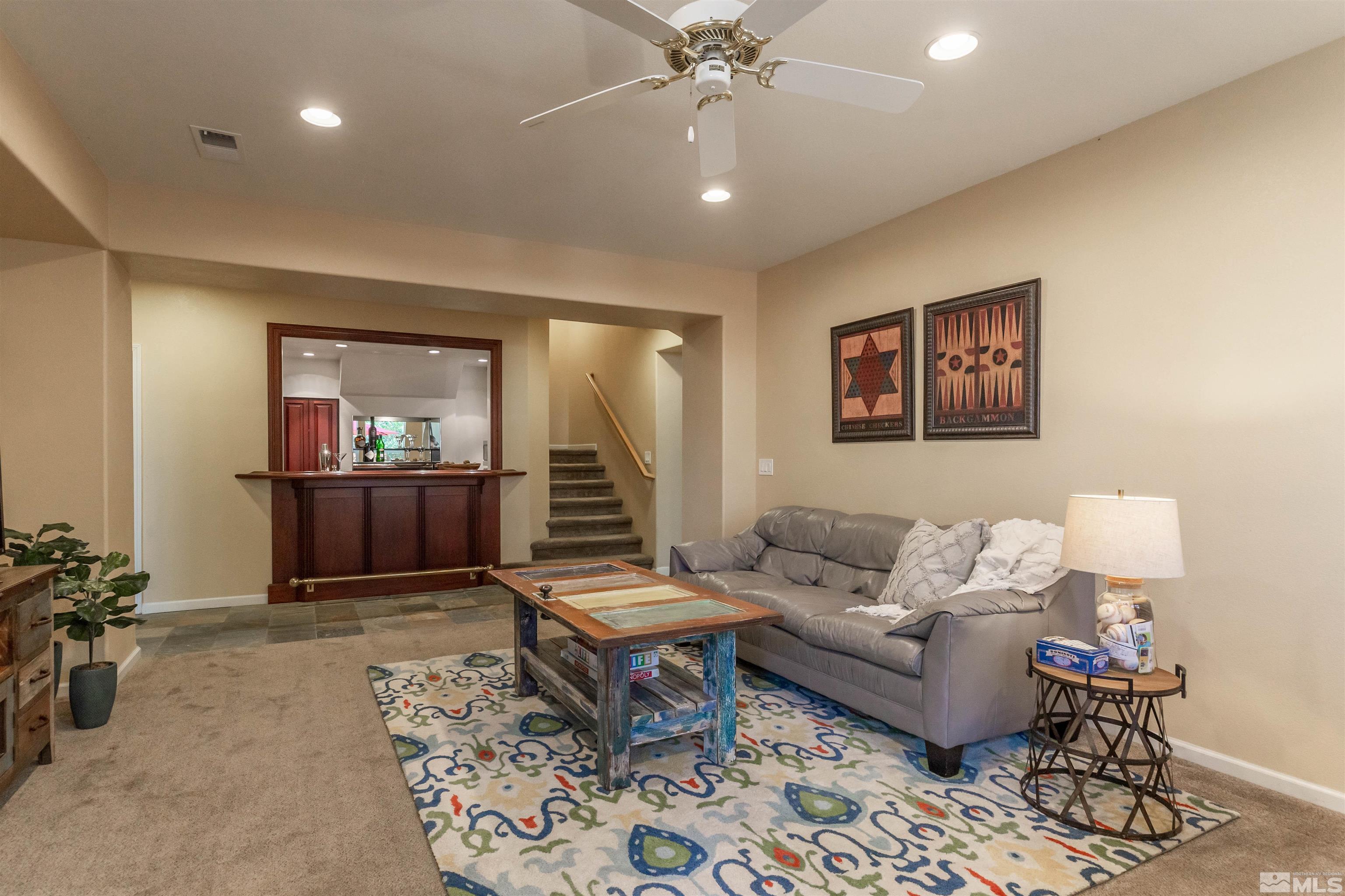 4829 Ramcreek Trail Reno, NV 89519 - Photo 28 of 40 a living room with furniture and a view of kitchen