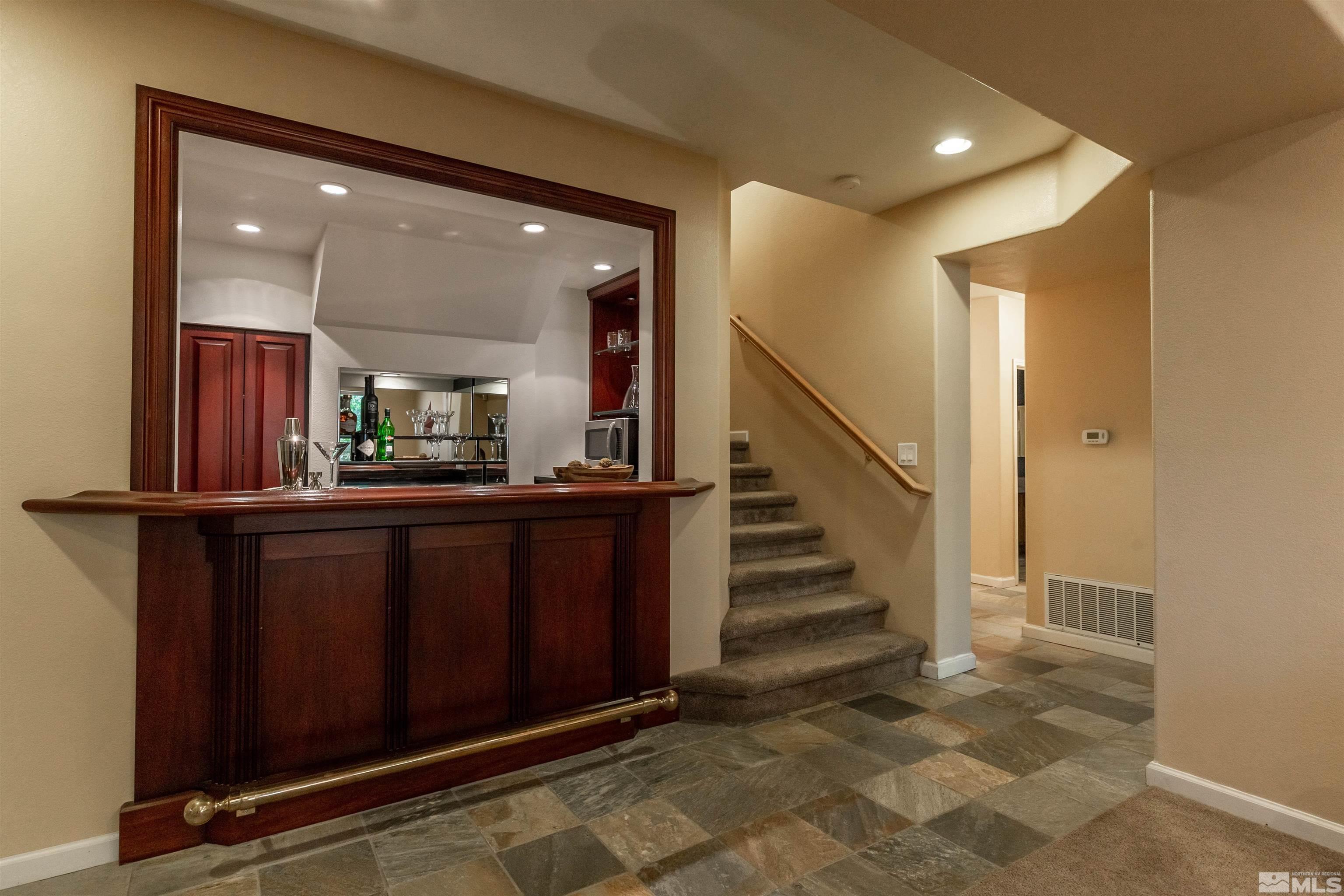 4829 Ramcreek Trail Reno, NV 89519 - Photo 30 of 40 a view of entryway with stairs and wooden floor