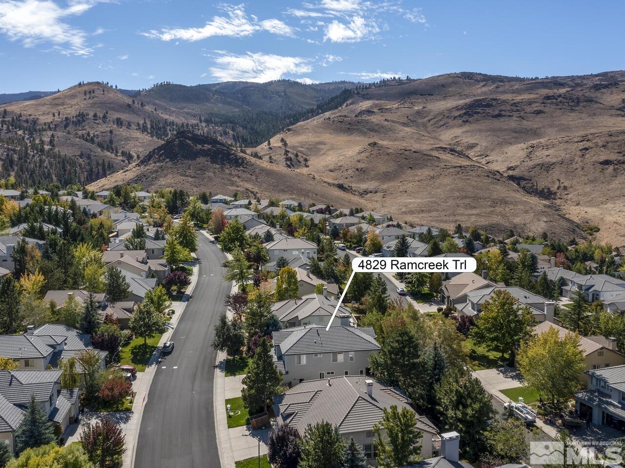 4829 Ramcreek Trail Reno, NV 89519 - Photo 3 of 40 an aerial view of residential houses with outdoor space