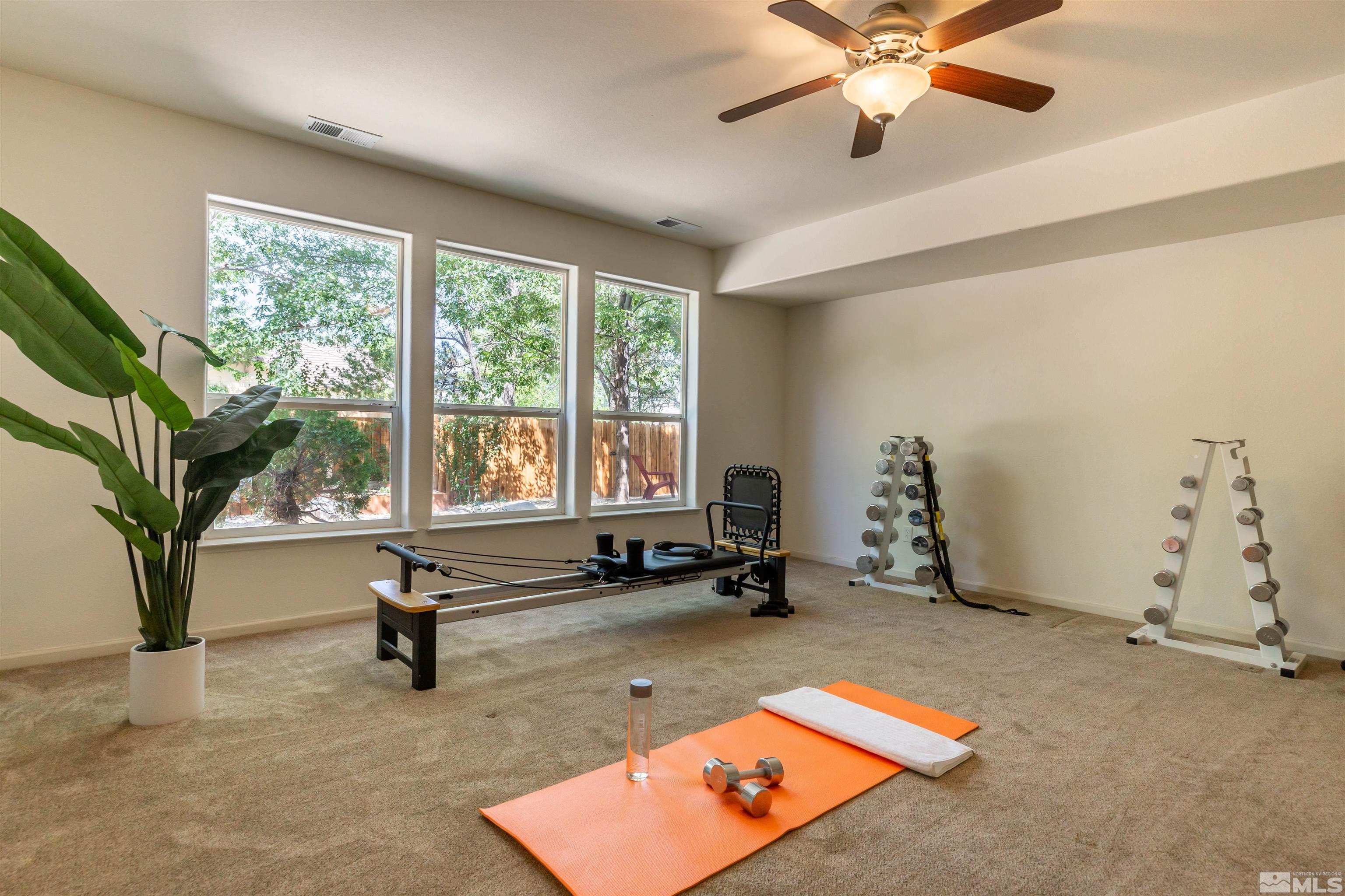 4829 Ramcreek Trail Reno, NV 89519 - Photo 32 of 40 a living room with couch guitar and a large window