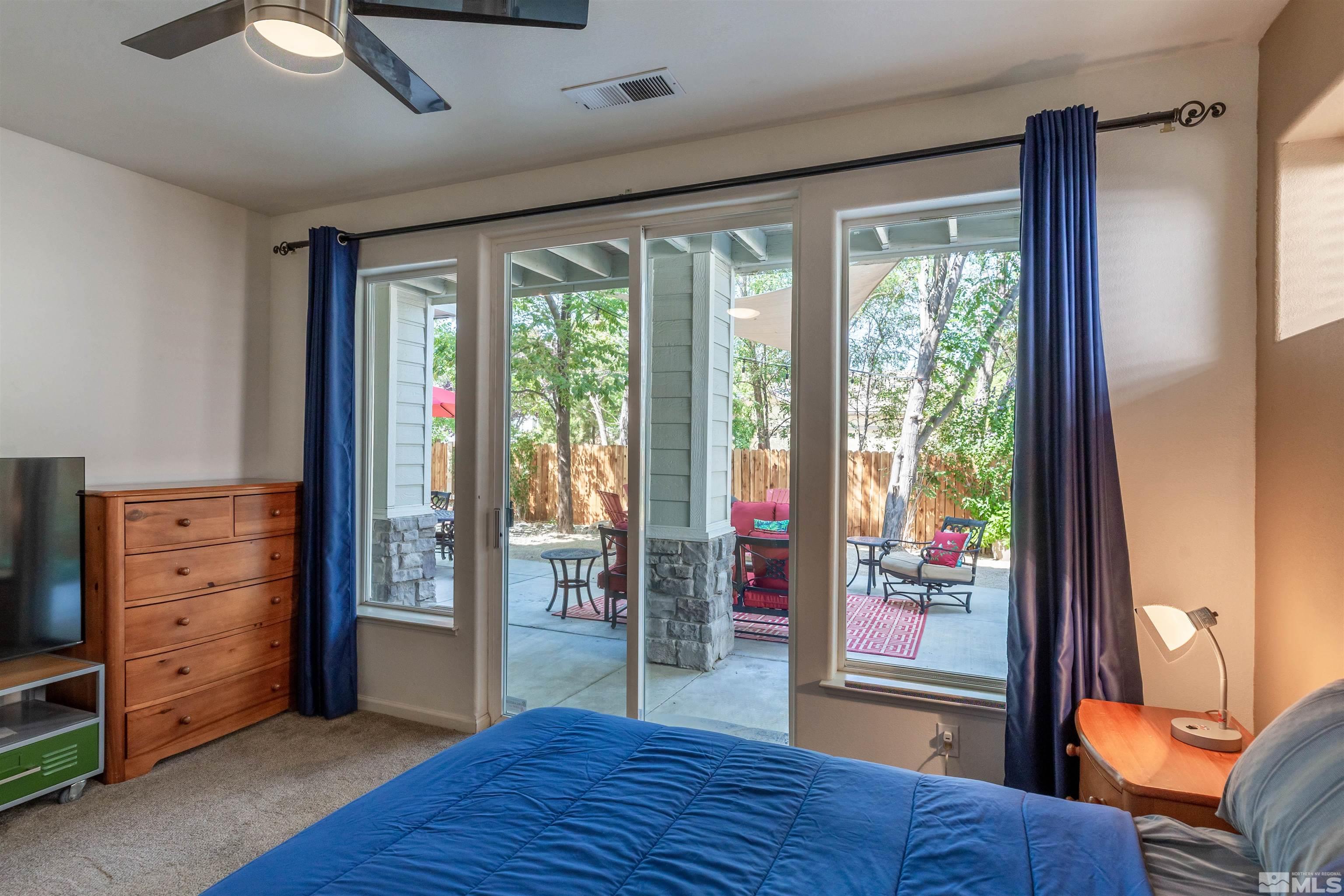 4829 Ramcreek Trail Reno, NV 89519 - Photo 33 of 40 a bedroom with a bed and wooden floor