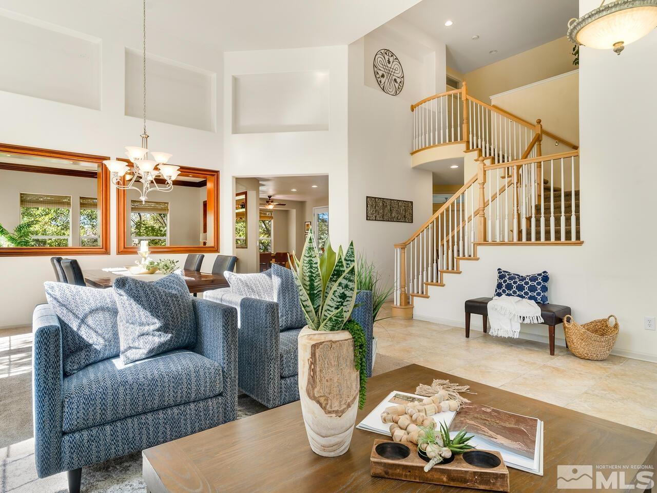 4829 Ramcreek Trail Reno, NV 89519 - Photo 8 of 40 a living room with furniture and a chandelier