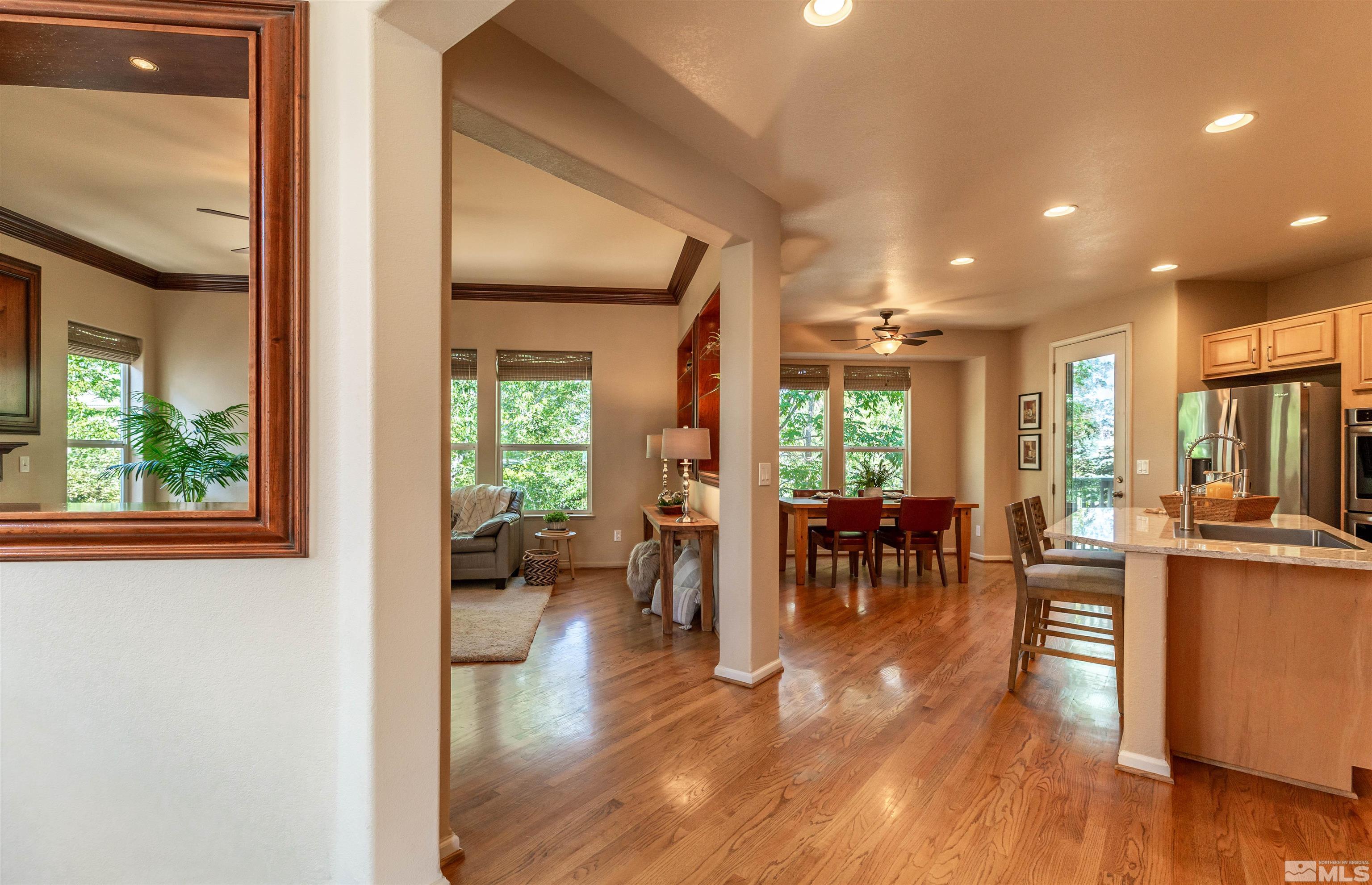 4829 Ramcreek Trail Reno, NV 89519 - Photo 10 of 40 a view of a dining room with furniture window and wooden floor