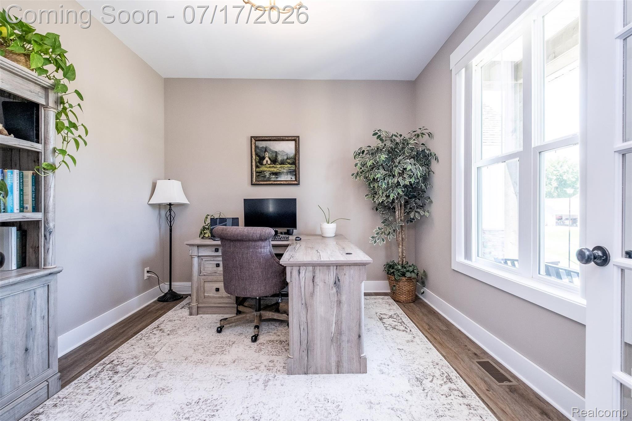 12349 Sugar Maple Drive Fenton, MI 48430 - Photo 6 of 67 Dedicated room with wood-finish flooring, neutral wall tones, and crown molding