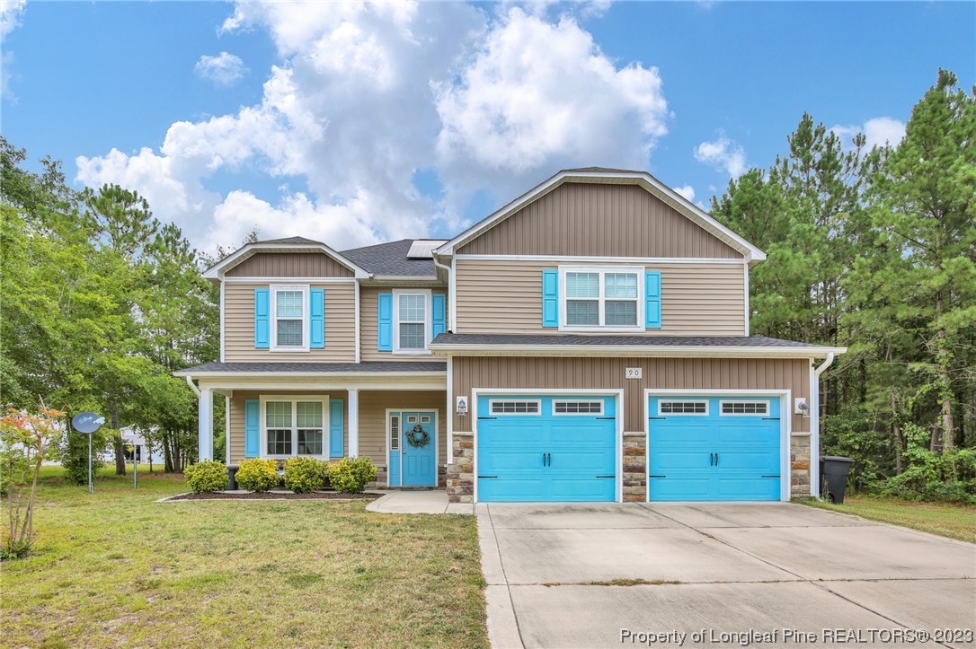 90 Eaker Drive Cameron, NC 28326 - Photo 1 of 36 a front view of a house with a yard