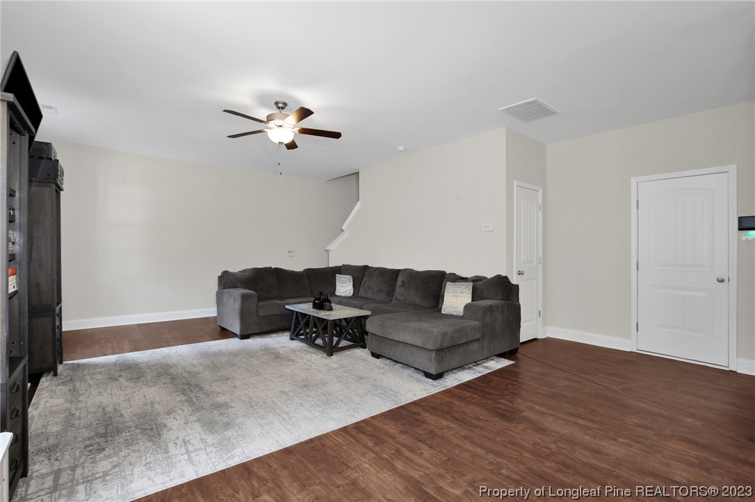 90 Eaker Drive Cameron, NC 28326 - Photo 13 of 36 a living room with furniture and a ceiling fan