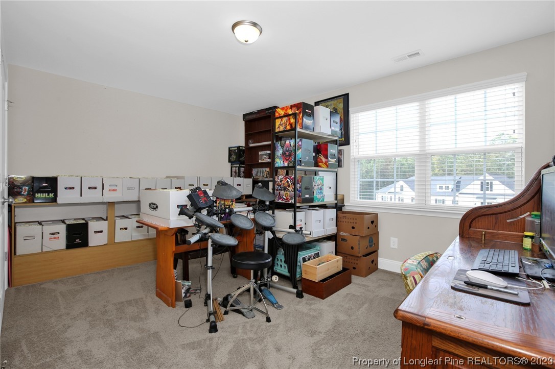 90 Eaker Drive Cameron, NC 28326 - Photo 18 of 36 a view of a workspace with furniture and a window