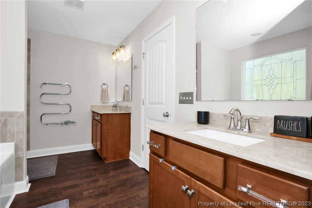 90 Eaker Drive Cameron, NC 28326 - Photo 23 of 36 a kitchen with granite countertop a sink and a stove top oven