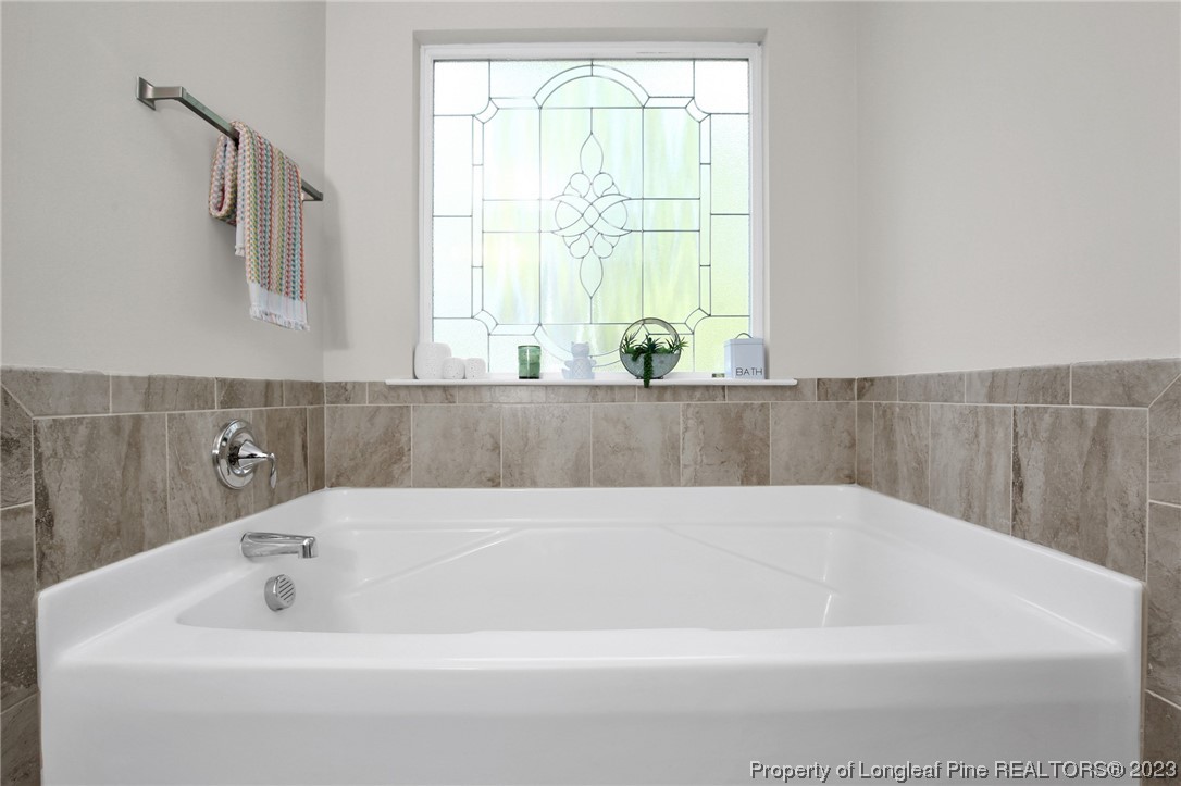 90 Eaker Drive Cameron, NC 28326 - Photo 24 of 36 a bathroom with a bathtub