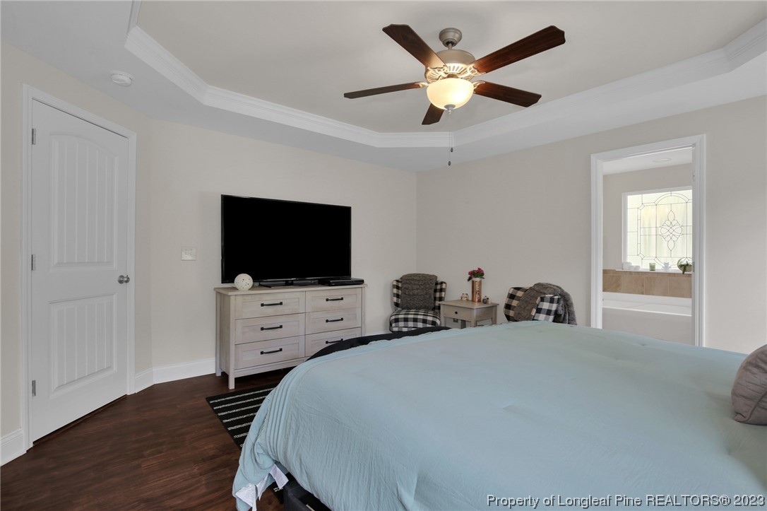90 Eaker Drive Cameron, NC 28326 - Photo 27 of 36 a living room with furniture and a flat screen tv