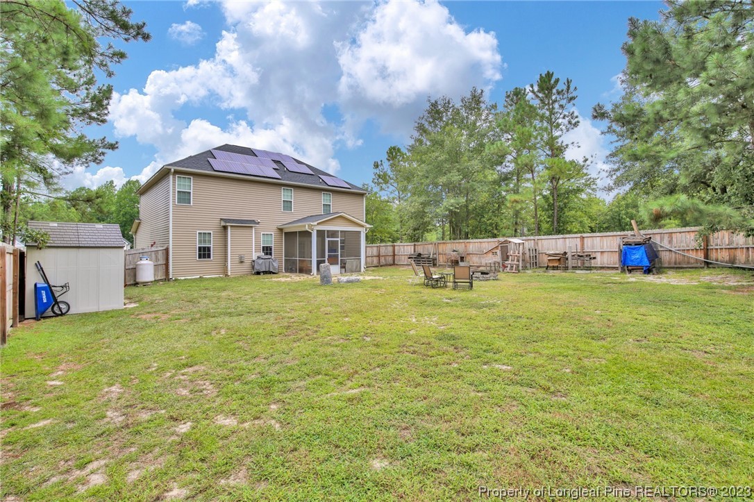 90 Eaker Drive Cameron, NC 28326 - Photo 32 of 36 a view of a house with backyard and garden