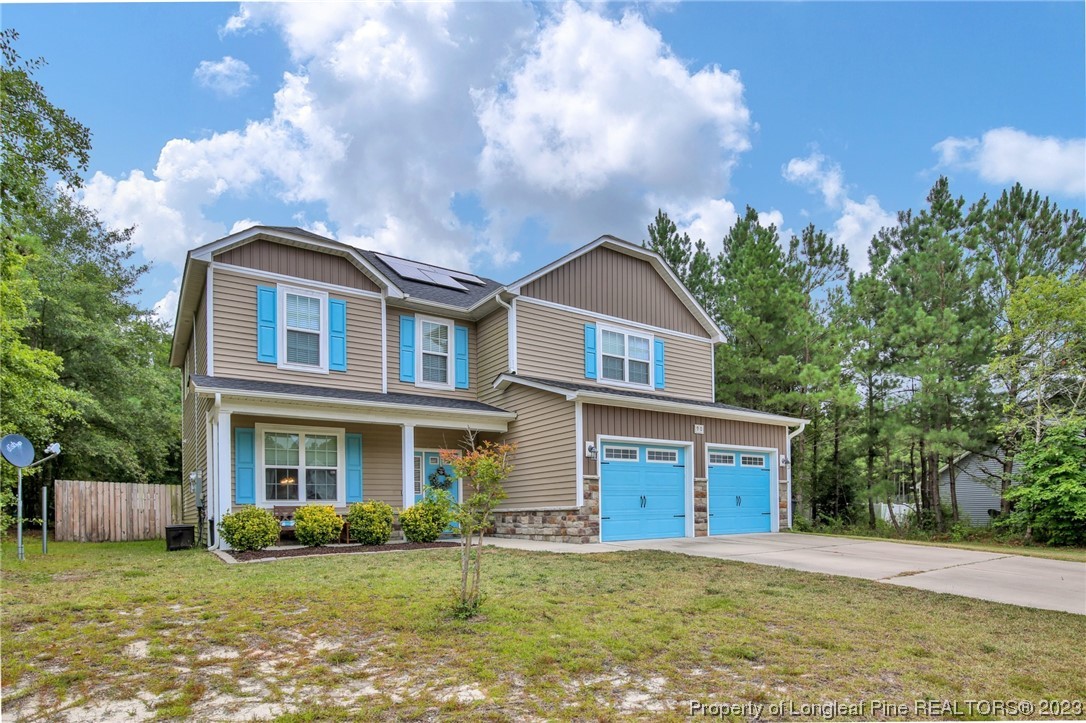 90 Eaker Drive Cameron, NC 28326 - Photo 36 of 36 a front view of a house with a garden