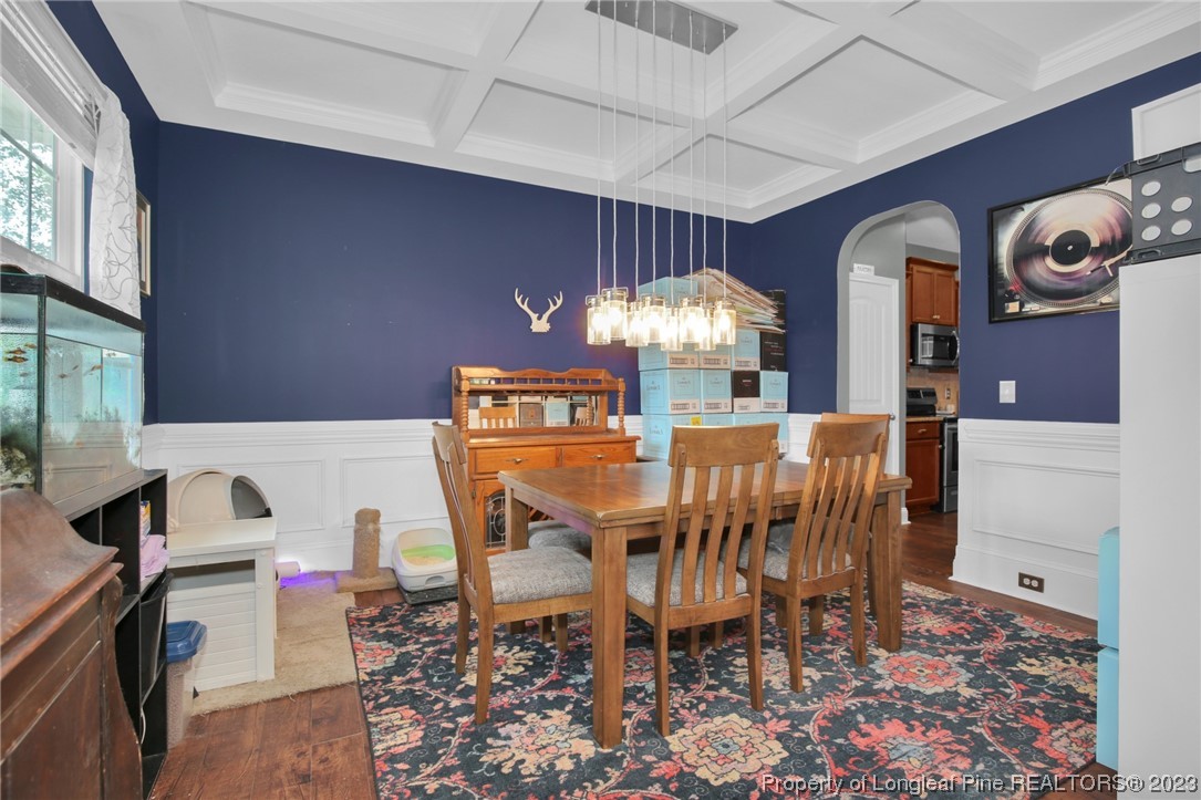 90 Eaker Drive Cameron, NC 28326 - Photo 9 of 36 a view of a dining room with furniture and chandelier