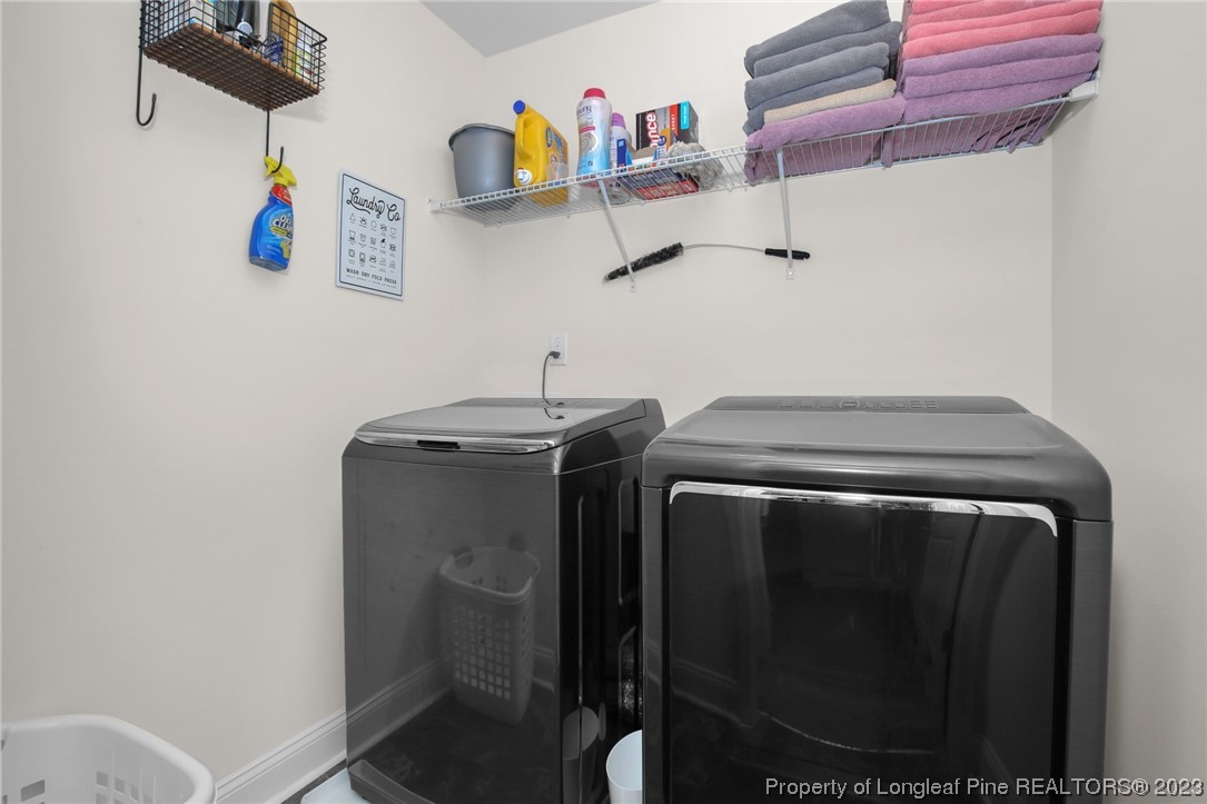 90 Eaker Drive Cameron, NC 28326 - Photo 10 of 36 a utility room with dryer and washer