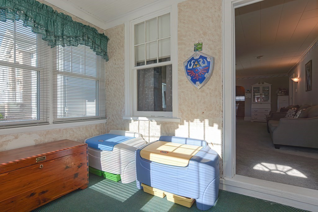 672 Cambridge Street Fall River, MA 02721 - Photo 6 of 35 a living room with furniture and a table