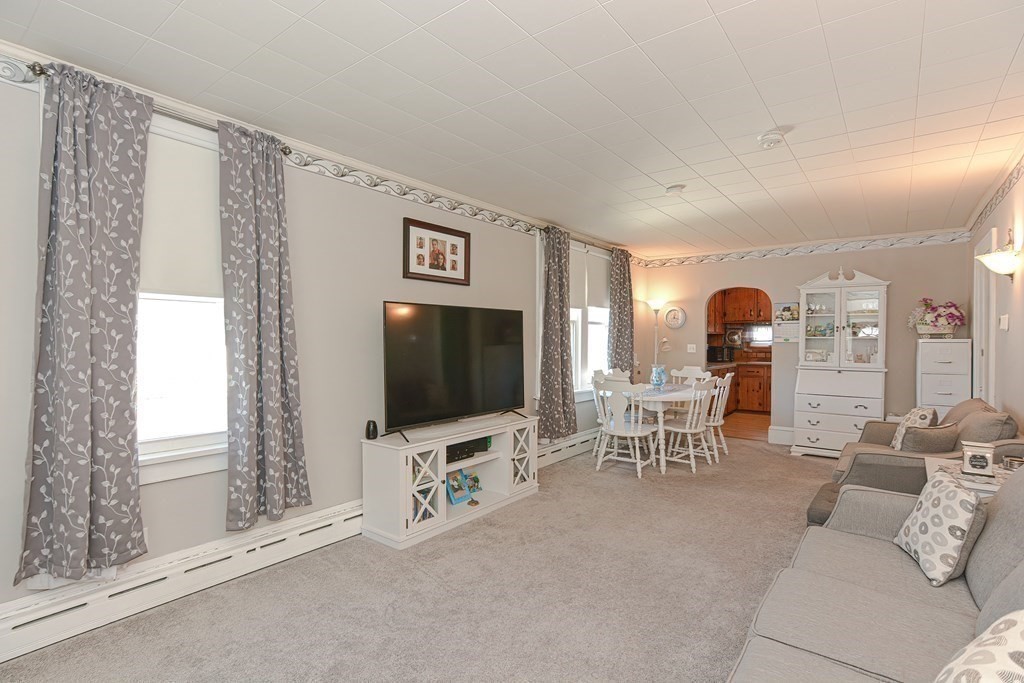 672 Cambridge Street Fall River, MA 02721 - Photo 8 of 35 a living room with furniture and a flat screen tv