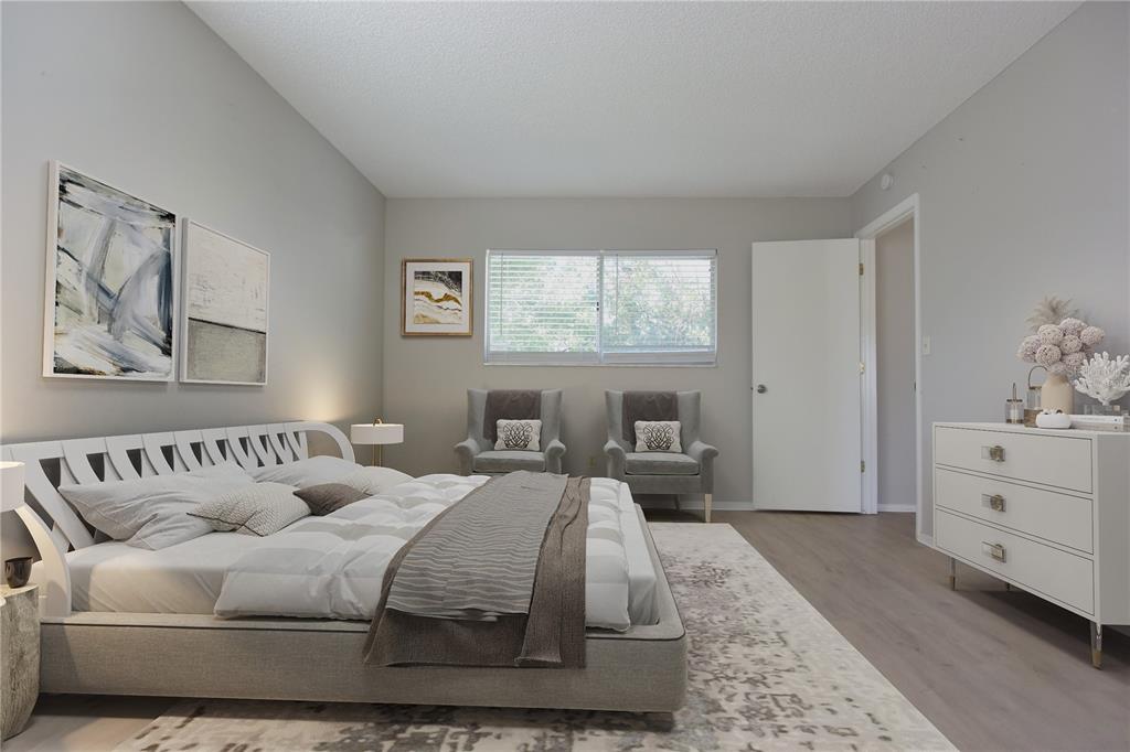 11341 Timbercrest Road Spring Hill, FL 34608 - Photo 13 of 35 a spacious bedroom with a bed and window