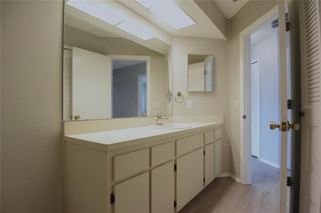 11341 Timbercrest Road Spring Hill, FL 34608 - Photo 22 of 35 a bathroom with a sink and mirror