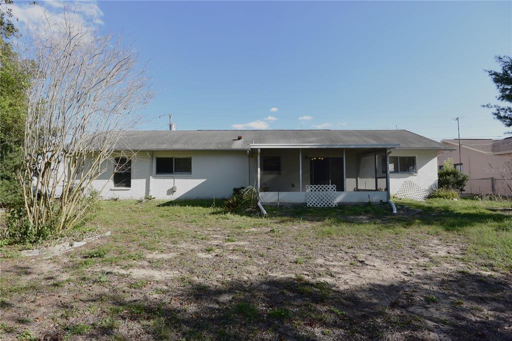 11341 Timbercrest Road Spring Hill, FL 34608 - Photo 29 of 35 a view of a house with a yard