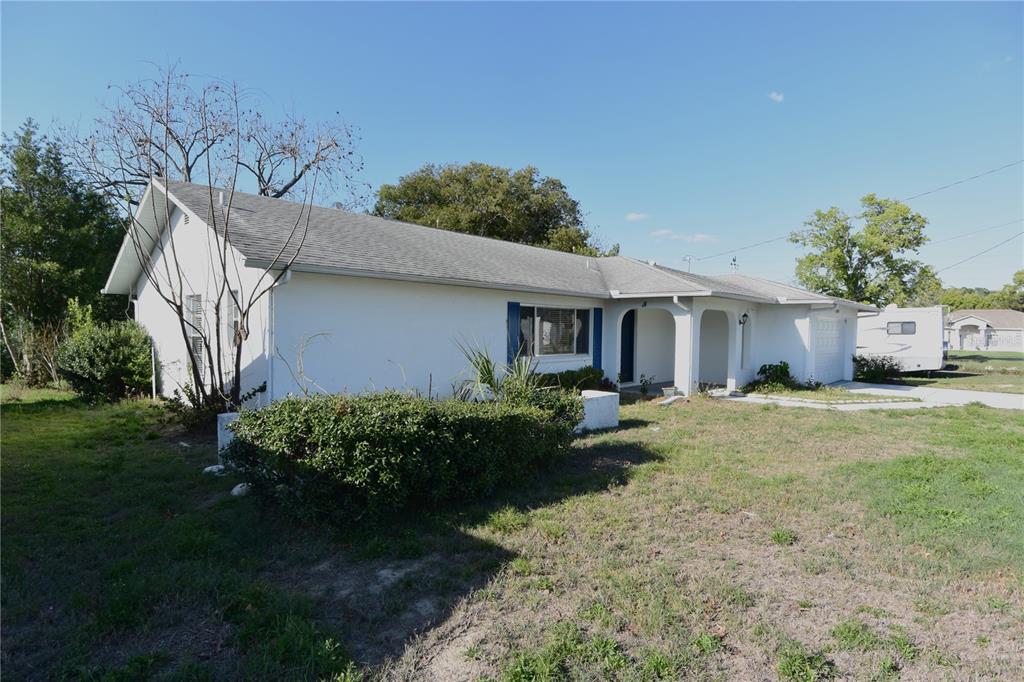 11341 Timbercrest Road Spring Hill, FL 34608 - Photo 32 of 35 a front view of a house with garden