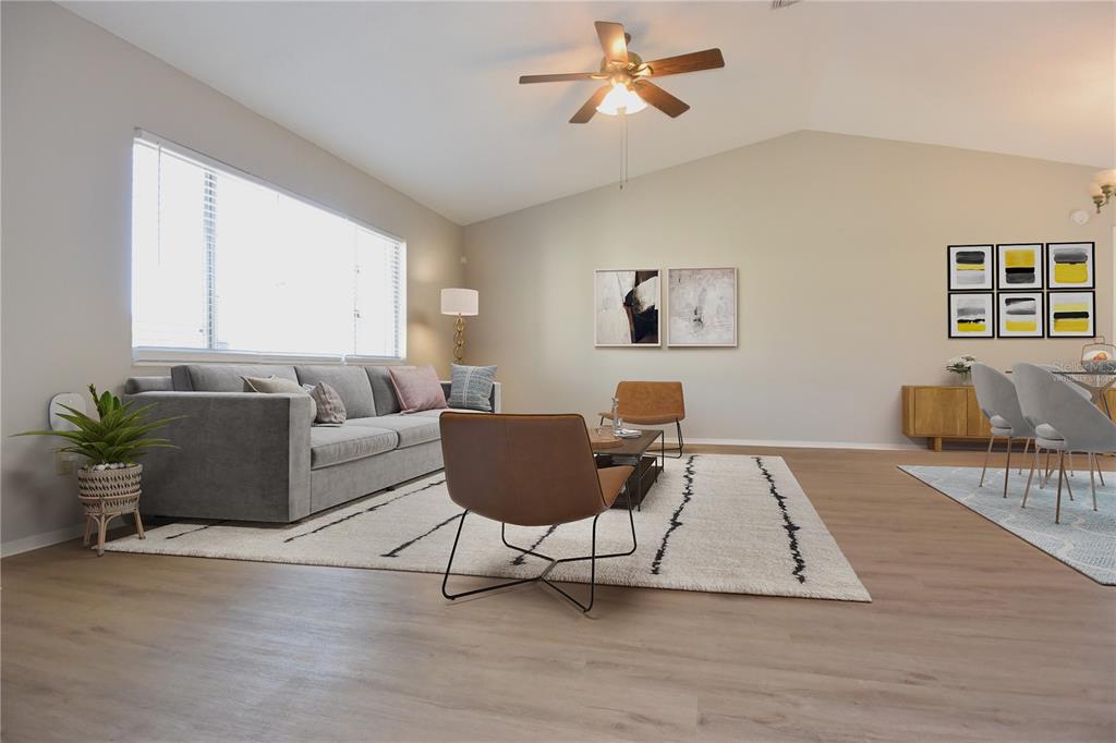 11341 Timbercrest Road Spring Hill, FL 34608 - Photo 6 of 35 a living room with furniture and a wooden floor