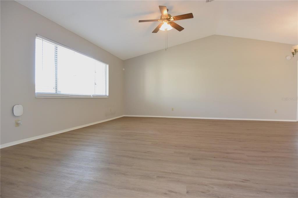 11341 Timbercrest Road Spring Hill, FL 34608 - Photo 7 of 35 wooden floor in an empty room