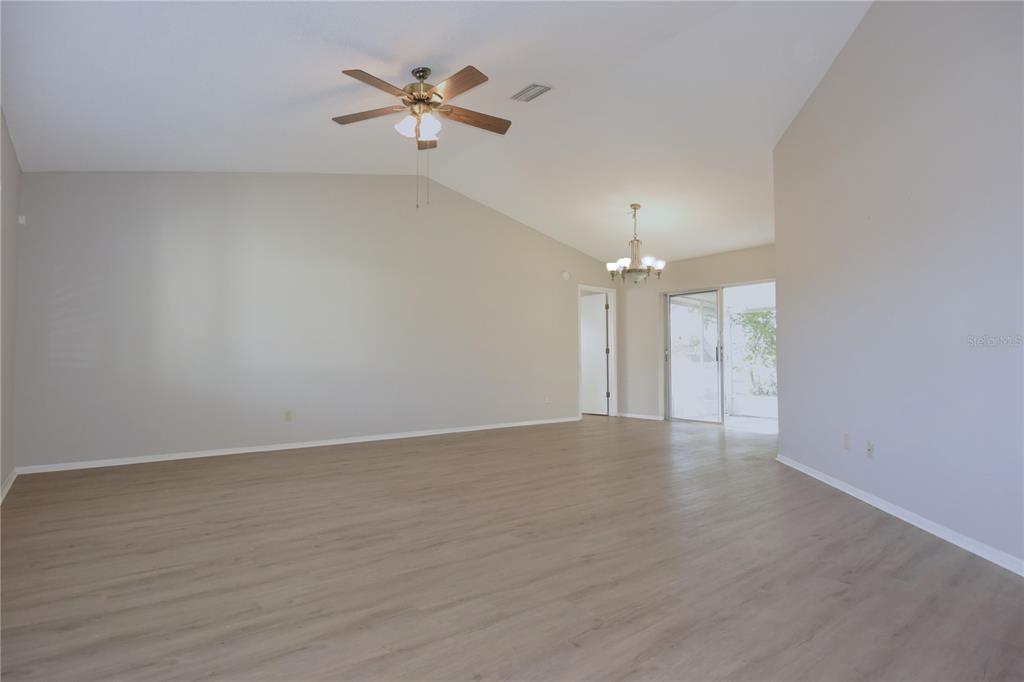 11341 Timbercrest Road Spring Hill, FL 34608 - Photo 9 of 35 wooden floor in an empty room