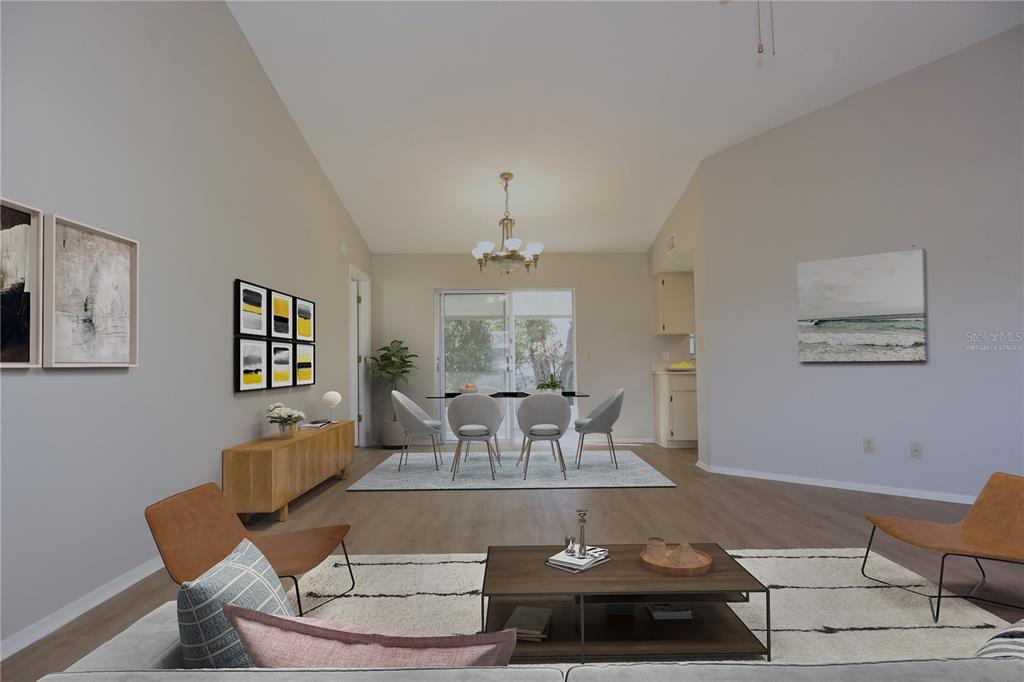 11341 Timbercrest Road Spring Hill, FL 34608 - Photo 10 of 35 a living room with furniture and a chandelier