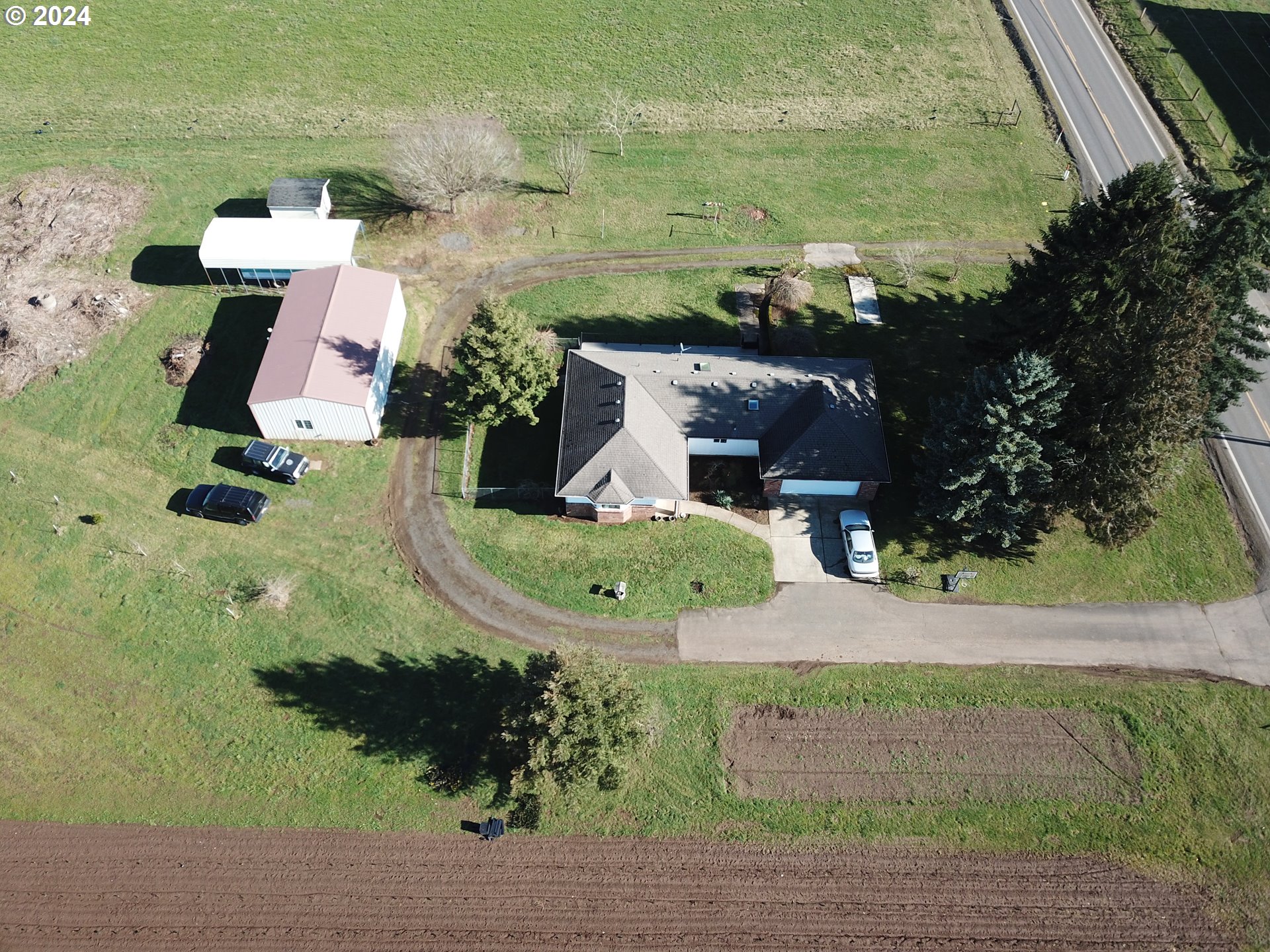 an aerial view of a house with outdoor space