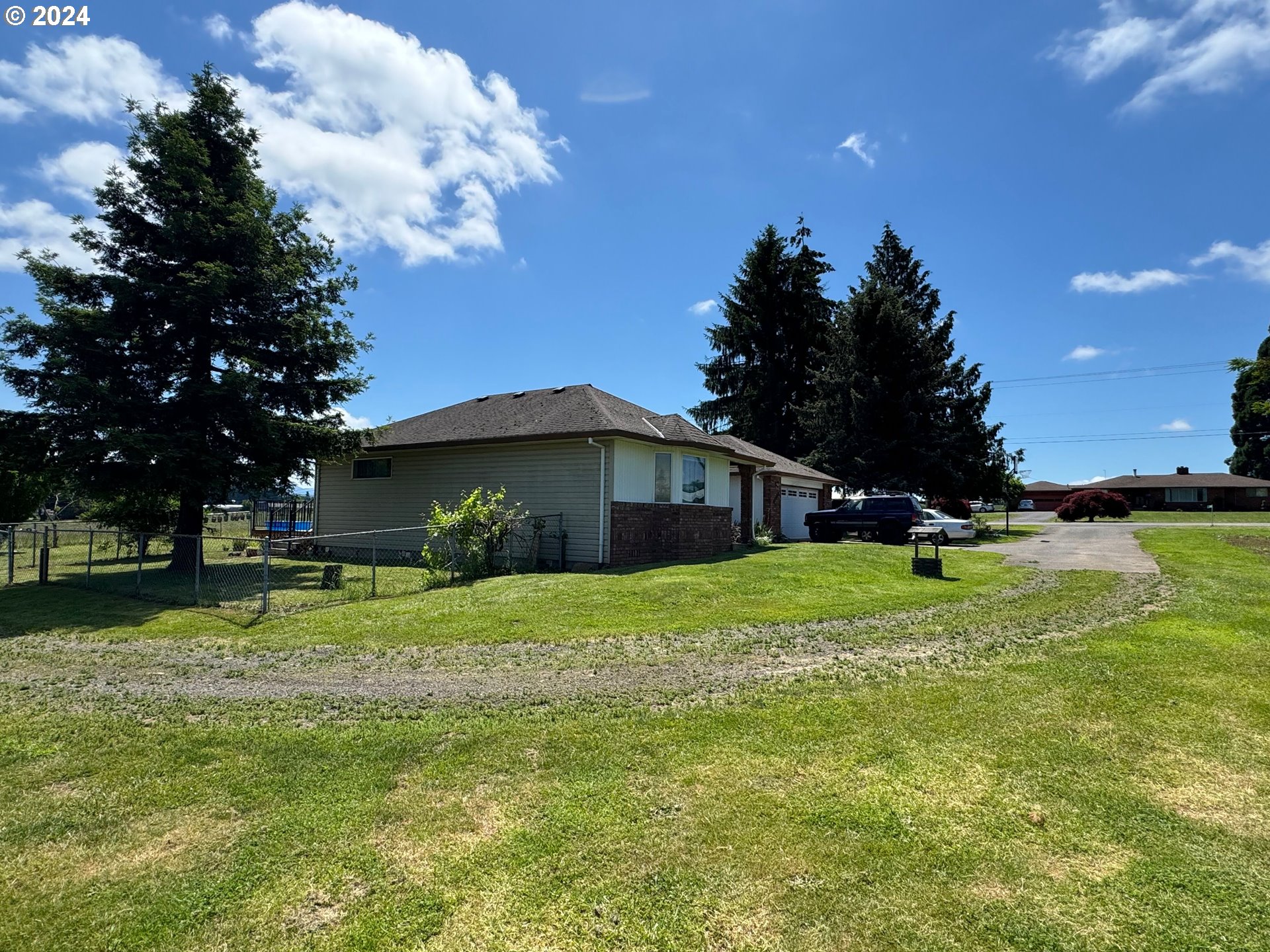 29815 Southeast Kelso Road Boring, OR 97009 - Photo 19 of 21 a view of a wooden house with a big yard and large trees