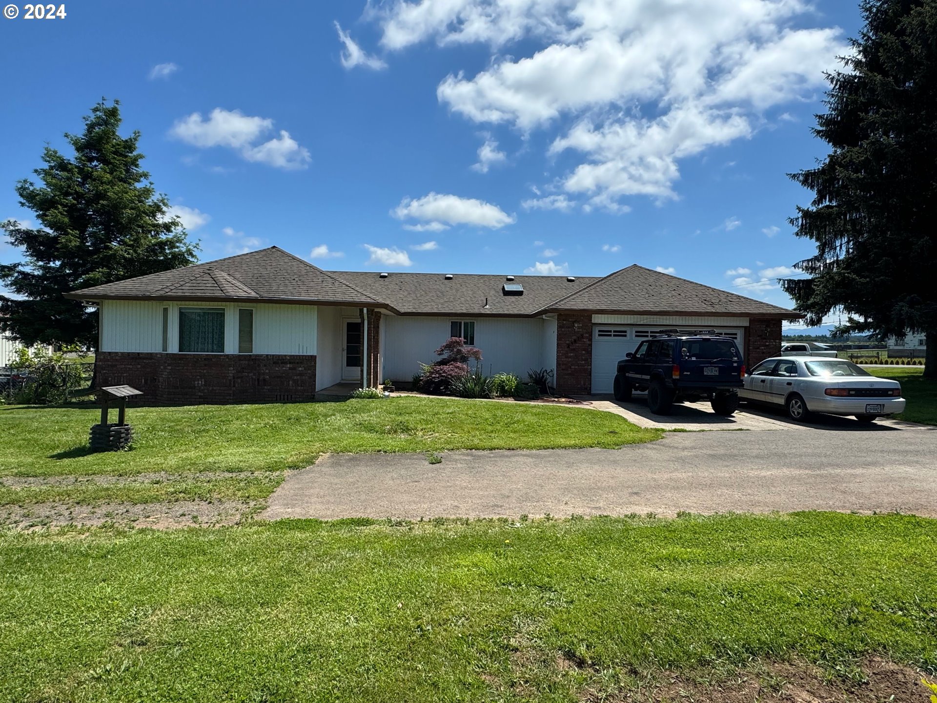 29815 Southeast Kelso Road Boring, OR 97009 - Photo 3 of 21 a front view of a house with a garden and yard