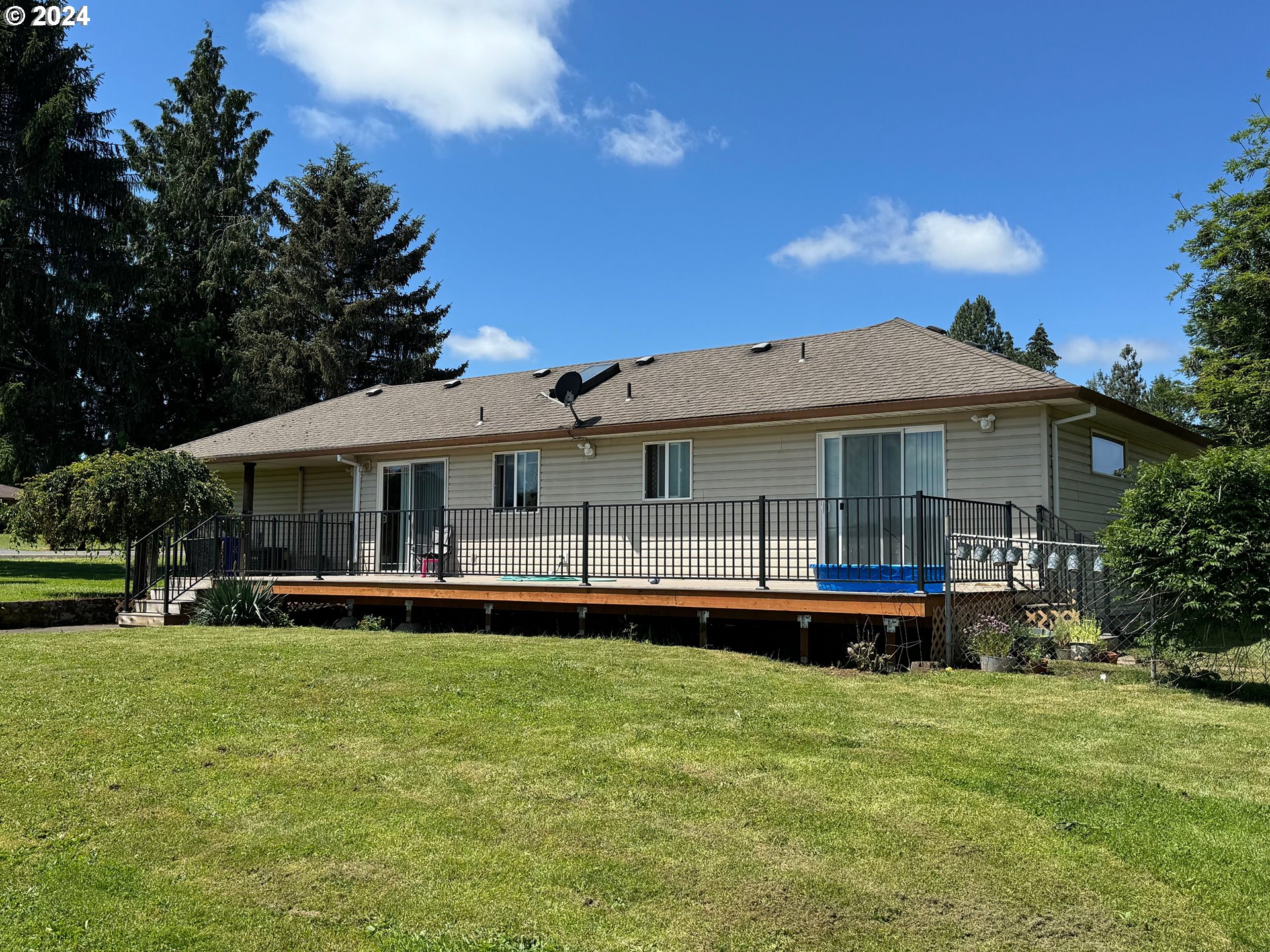 29815 Southeast Kelso Road Boring, OR 97009 - Photo 4 of 21 a front view of a house with a yard table and chairs