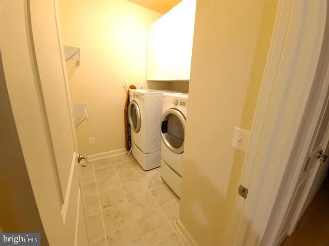 a bathroom with a double vanity sink toilet and shower