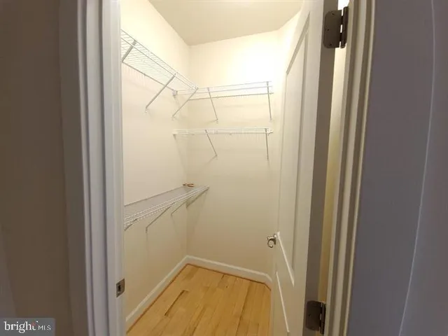 a view of a hallway with washer and dryer